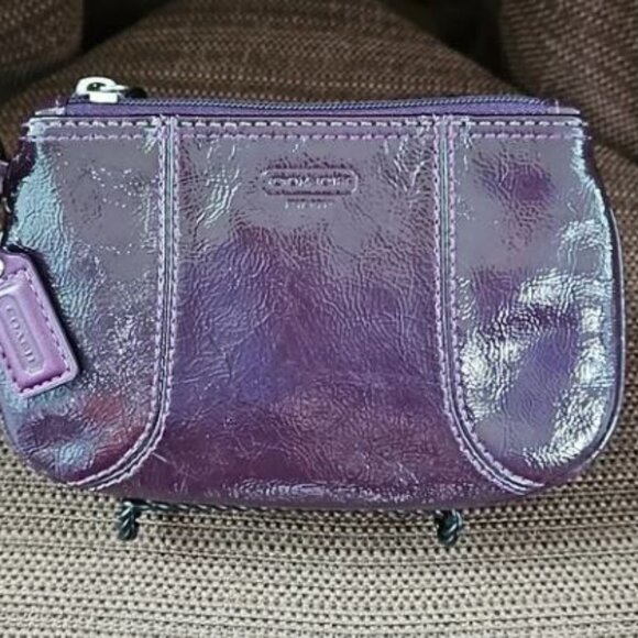 EUC Coach patent leather wristlet in dark purple or plum color and silver metal - Picture 1 of 10